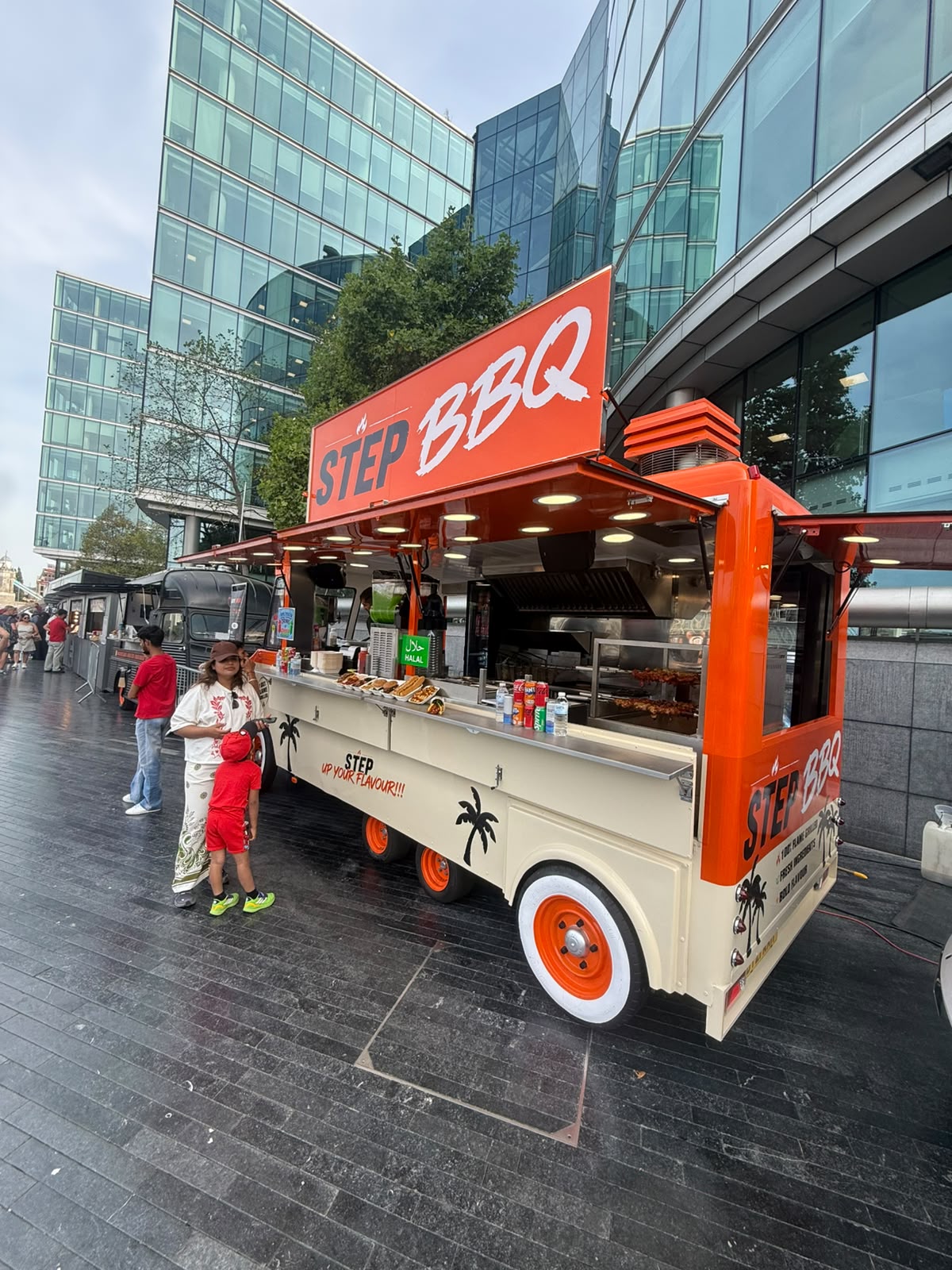 Step BBQ truck serving customers
